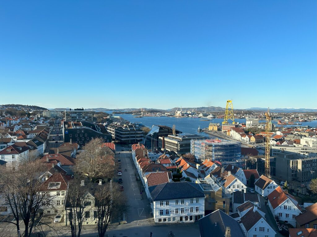 Stavanger harbour and skyline on a sunny day. You can see the sea and blue skies.